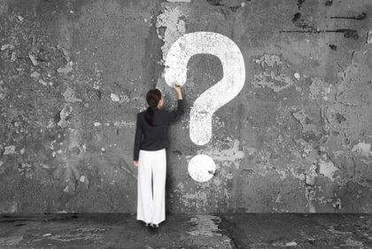 Fragezeichen auf Mauer