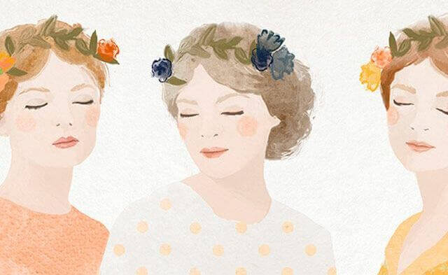 Drei Frauen mit Blumen auf dem Kopf