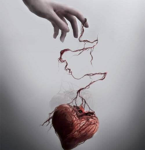 Herz hängt an einer Hand