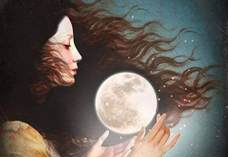 Frau hält den Mond in ihren Händen