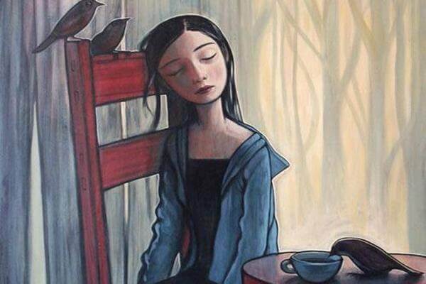 Frau-traurig-auf-Stuhl-sitzend