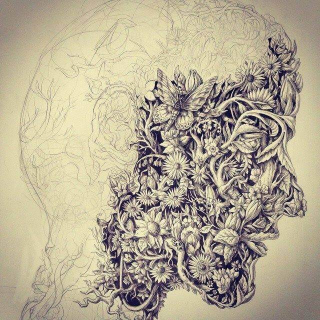 Mann mit Maske aus Pflanzen