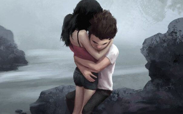 Paar in Umarmung auf einem Fels