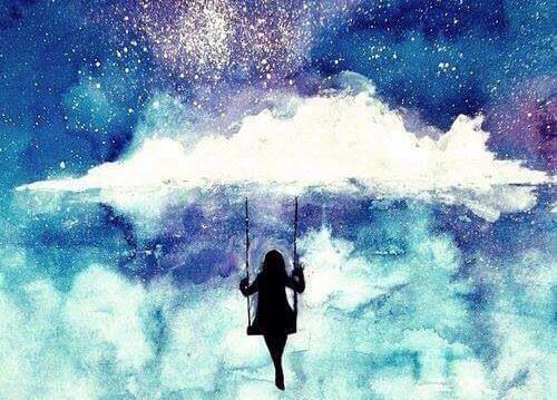 maedchen-auf-schaukel-in-den-wolken