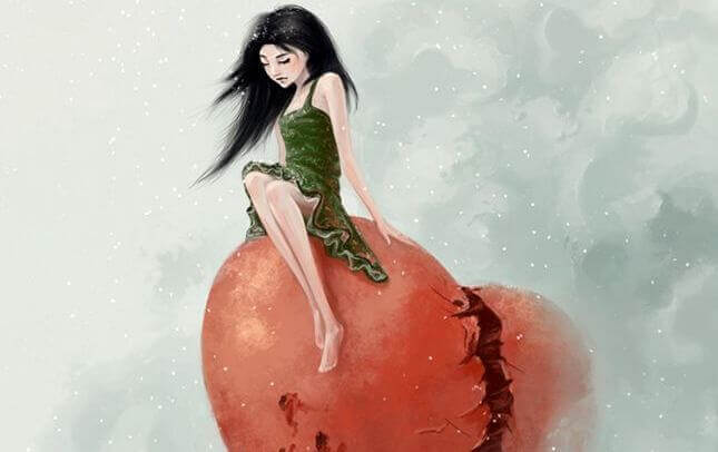 Frau sitzt auf gebrochenem Herz