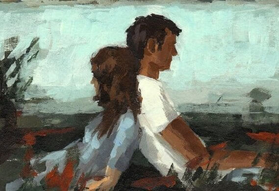 Pärchen sitzt Rücken an Rücken