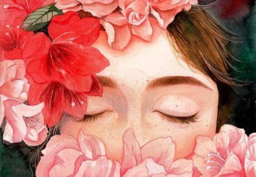 Frau mit geschlossenen Augen hinter Blumen
