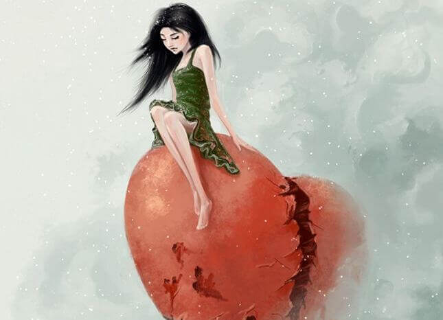 Frau sitzt auf rotem Herz