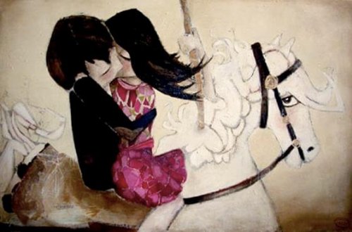 Paar, das sich auf einem Pferd küsst