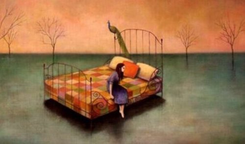 Trauriges Mädchen, das auf dem Bett sitzt