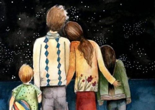 Glückliche Familie vor Sternenhimmel