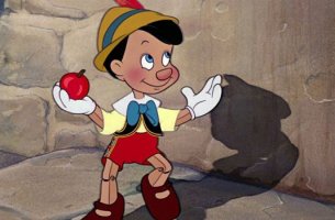 Bedeutung von Bildung - Pinocchio mit einem Apfel in der Hand