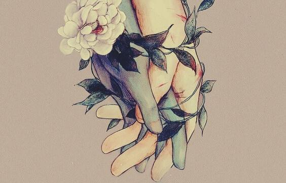 Hände umschließen sich umgeben von Blumen
