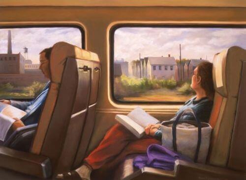 Frau mit Buch schaut aus dem Zug