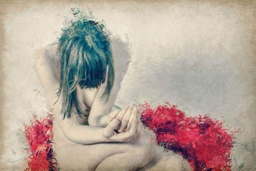 In sich zusammengesunkene Frau