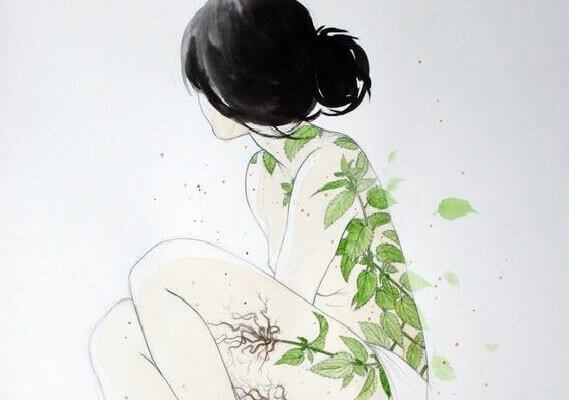 Frau mit Pflanzen auf der Haut