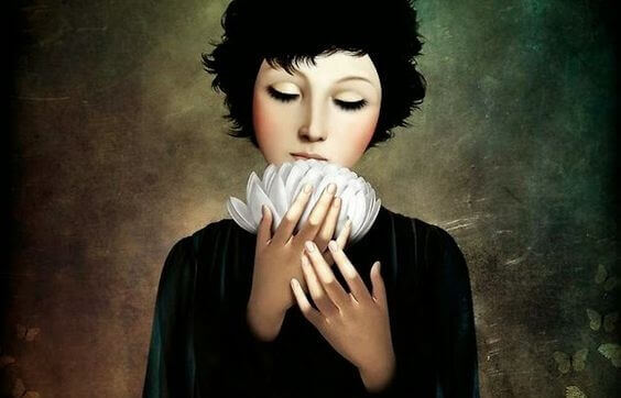 Ein Bild einer Frau, die eine weiße Blume in ihren Händen hält