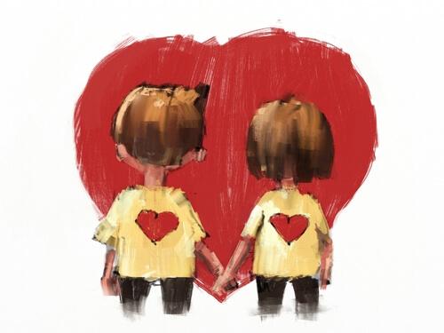 Paar, das vor einem Herz Händchen hält