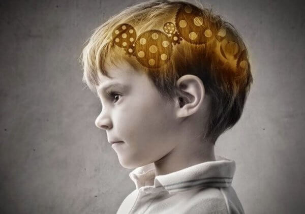 Das Gehirn im Kopf eines Jungen, mit Zahnrädern dargestellt