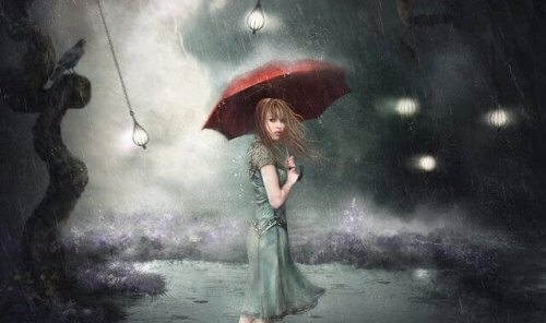Eine Frau steht mit einem roten Regenschirm im Sturm.