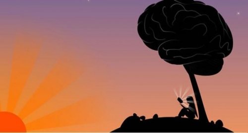 Frau liest unter einem Baum