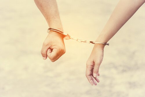 ungesunde Beziehung - Handschelle